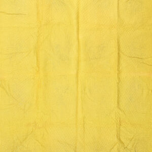 Bright yellow quilted textile featuring floral stitching is folded back to reveal a contrasting aqua reverse side.