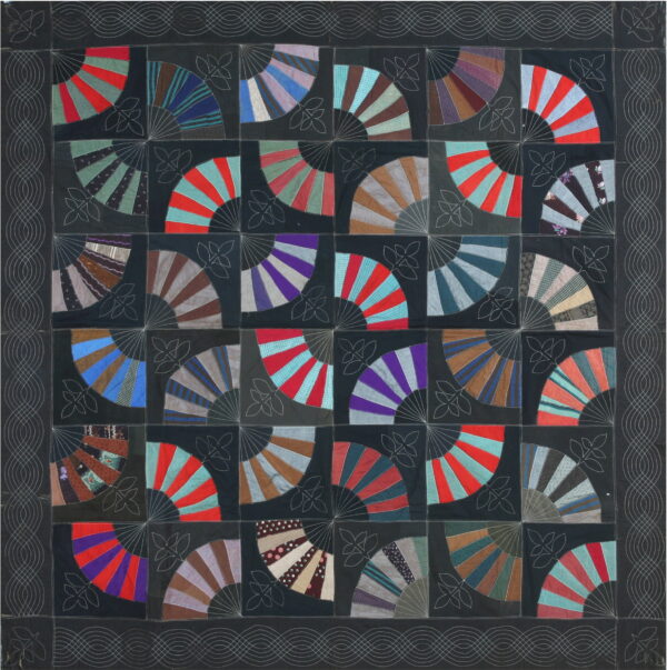 A dark textile featuring a grid of multicolored fan patchwork patterns with white decorative stitching.