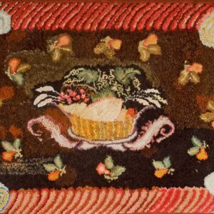 Textured high-pile rug with a central dark medallion featuring a fruit basket and a diagonally striped red and gold border.