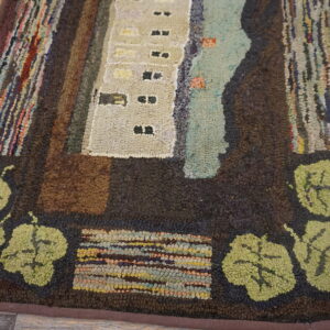 Rustic hooked rug with dark brown border, green leaves, and abstract beige architecture on distressed wood floors.