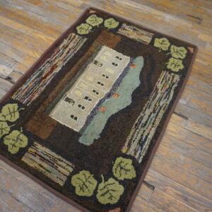 Textured folk art rug showing a beige building and aqua water surrounded by dark brown and green leaves.