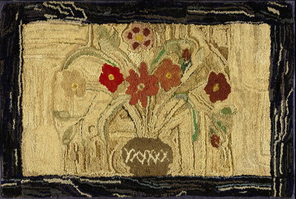 High-texture rug featuring a still life of red and rust flowers in a vase with a dark border.