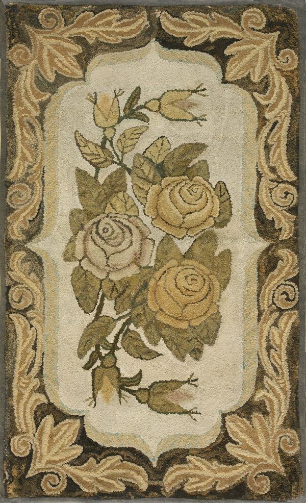 Floral hooked rug features yellow and cream roses with green leaves surrounded by a dark brown acanthus border.