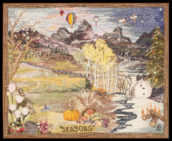 A densely hooked multicolor rug illustrates a detailed landscape combining elements of all four seasons and the word "seasons. "
