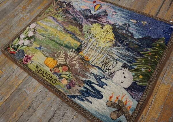 Textured multicolored pictorial rug depicting the four seasons rests on distressed gray and yellow wooden plank flooring.