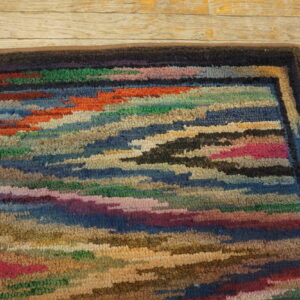 Colorful, textured vintage hooked rug