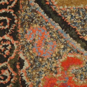 Colorful floral design on textured rug