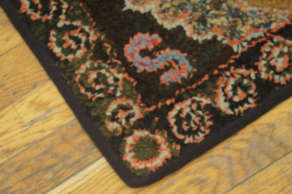 Colorful patterned antique hooked rug
