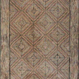 Muted multi-colored rug with a complex stepped geometric field pattern and a wide textured strip border.