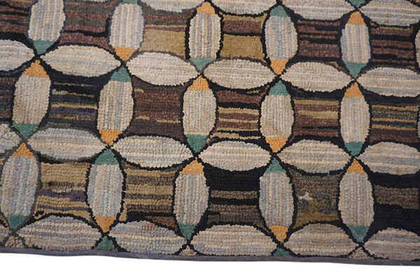 Geometric high-pile rug featuring large light beige interlocking ovals and dark brown striped square shapes.