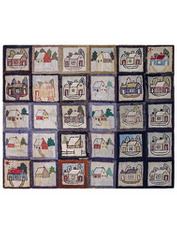 A close-up of a nubbly, multicolor rug featuring folk art house designs inside black-bordered squares.