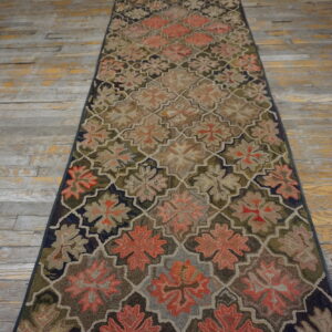 Highly textured runner rug with a quatrefoil floral pattern in muted coral, tan, and olive green.