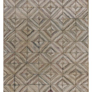 Muted beige rug covered in a repeating grid of stepped diamond motifs using faded multicolored lines.