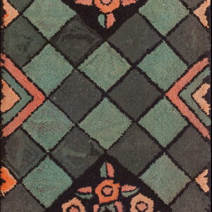 Teal and dark green diamond rug accented by coral and peach floral motifs on a black ground.