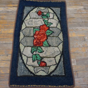 Blue rug with floral design.