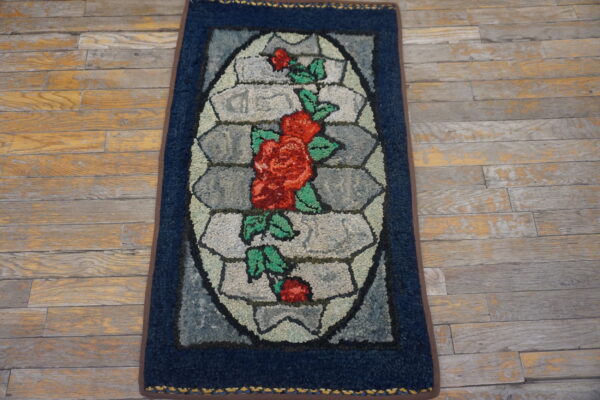 Blue rug with floral design.