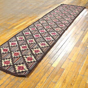 Colorful patterned runner on wooden floor