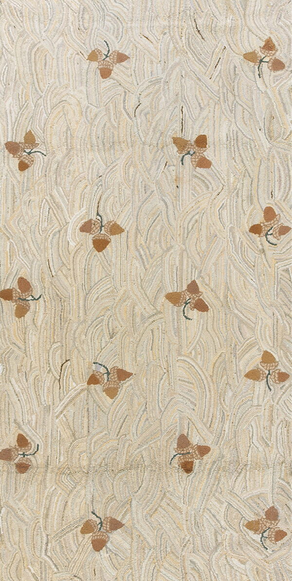 A textured rug displays a wavy background pattern of beige and cream with scattered brown acorn designs.