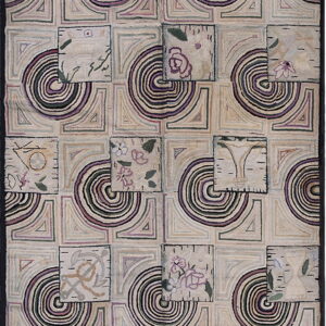 Geometric patchwork rug in cream, purple, and green with offset squares showing floral and nautical designs.