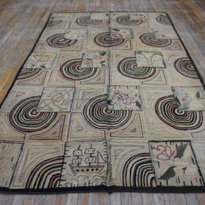 A highly textured rug with purple and green geometric and pictorial motifs rests on distressed wooden floorboards.