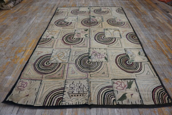 A highly textured rug with purple and green geometric and pictorial motifs rests on distressed wooden floorboards.
