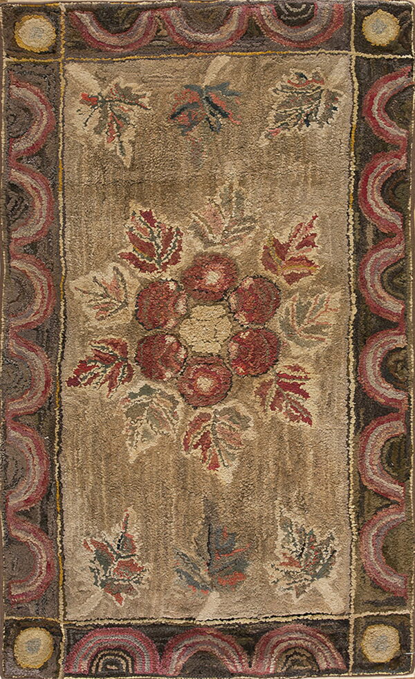 Muted brown and red hooked rug with a central flower cluster and repeating scalloped border design.