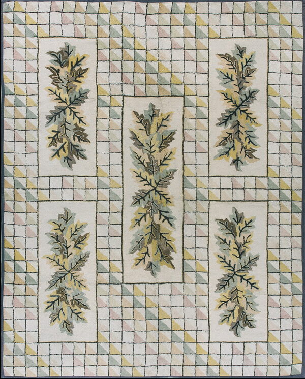 A cream rug featuring a green and yellow foliage design framed by a border of pastel checkered triangles.