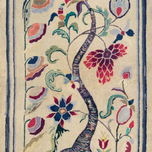 Oblong hooked rug featuring a colorful tree of life motif on a cream field over weathered wood planks.
