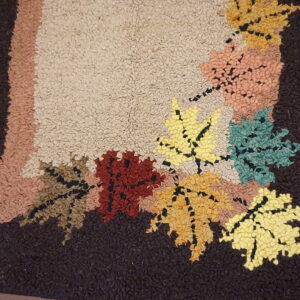 Colorful autumn leaves on textured rug