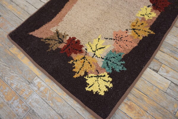 Colorful leaf-patterned vintage hooked rug