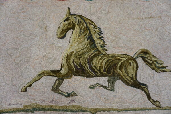 Rug with a dense, looped texture showing a green and brown stylized horse on a pale beige background.