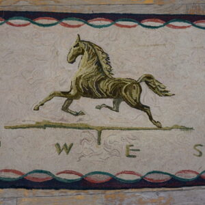 Cream and olive hooked rug featuring a running horse, compass points, and a multicolored serpentine border on wooden flooring.
