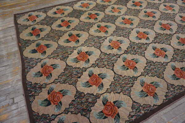 Textured floral rug featuring coral roses in tan medallions set against a multicolored mottled ground on wooden planks.