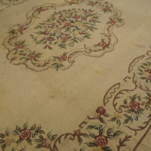 Floral patterned antique hooked rug