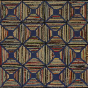 Textured rug with multicolored striped blocks forming a geometric lattice pattern defined by solid blue lines.