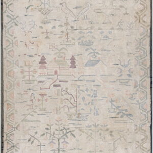 A muted cream rug featuring primitive pictorial designs of birds, trees, and houses in soft pastel colors.