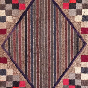 Textured rug featuring a central diamond of vertical stripes framed by multicolored red, gray, and beige squares.