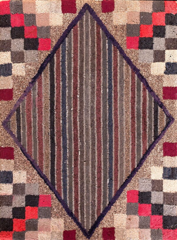 Textured rug featuring a central diamond of vertical stripes framed by multicolored red, gray, and beige squares.