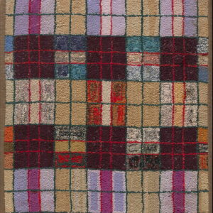 A chunky multicolored rug with a plaid grid pattern of purple, maroon, beige, and red squares.