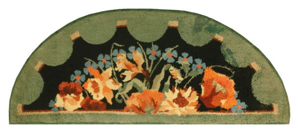 Semicircular rug with a black field featuring orange and blue flowers, framed by a scalloped sage green border.