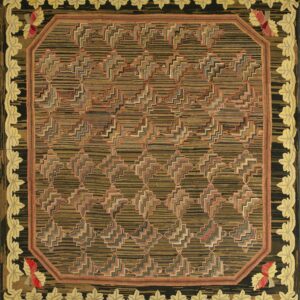 Hooked rug with a striped brown zigzag pattern center and a high-relief yellow leaf and black border.