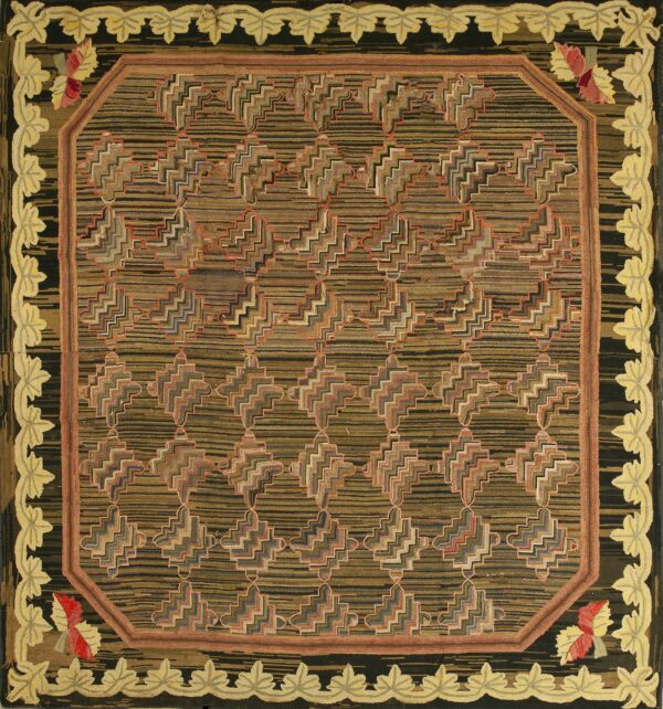 Hooked rug with a striped brown zigzag pattern center and a high-relief yellow leaf and black border.