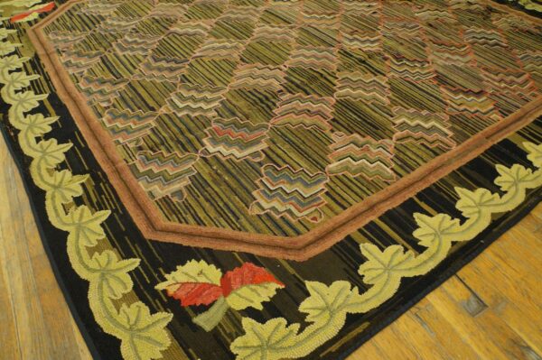 Textured low-pile rug with geometric olive and black field and a black border of stylized chartreuse leaves.