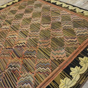 Textured square rug featuring dark stripes, multicolored zigzag cloud motifs, and a yellow-green leafy border.