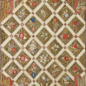 Textured brown rug with a cream floral lattice, featuring red scrolling botanical motifs at the corners.