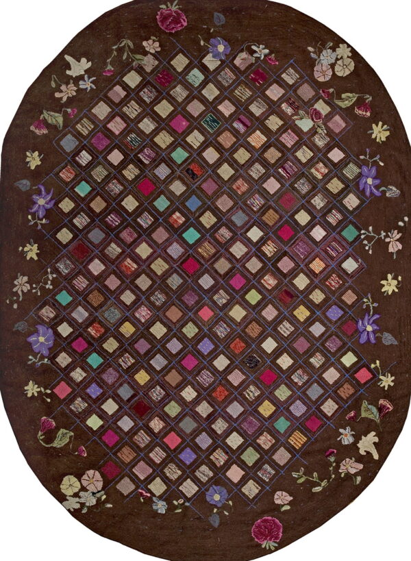 Dark brown oval rug featuring a high-pile, multicolored diamond patchwork grid bordered by floral designs.
