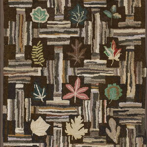 Hooked brown rug with chunky pile, featuring variegated vertical blocks, colorful leaves, and "HEP 1953" text.