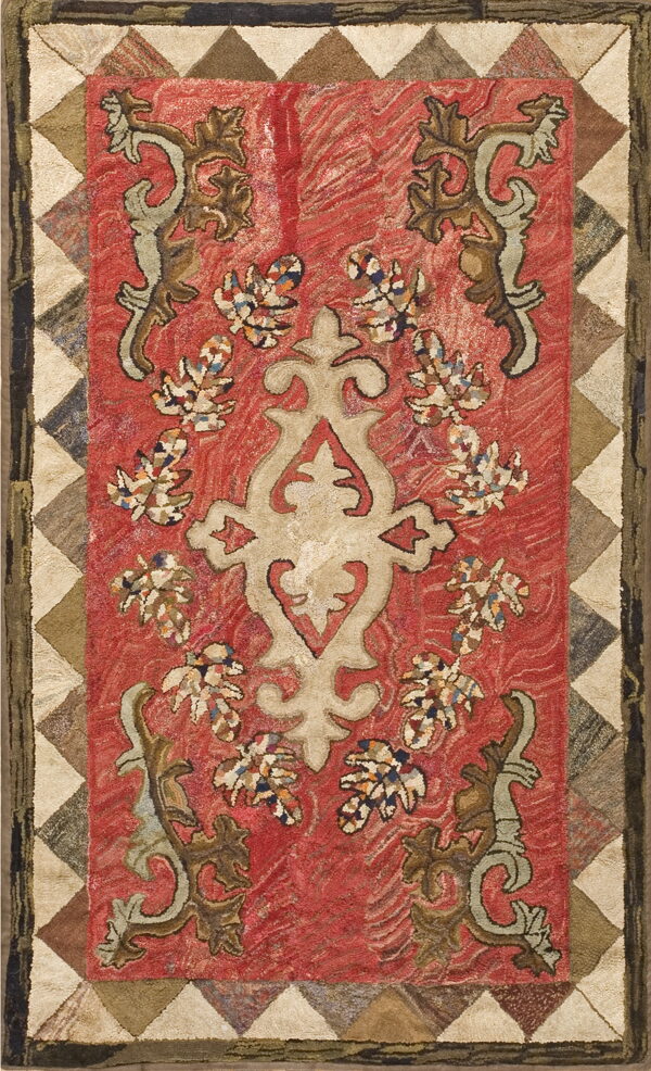 Rustic hooked rug featuring a cream medallion, brown scrolling florals on a wavy red background, and a checkered border.