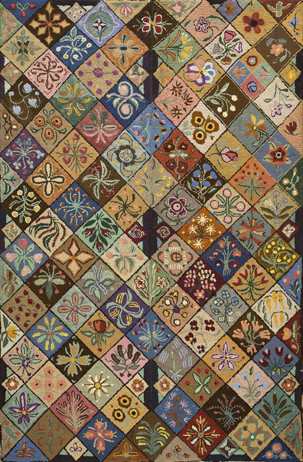 Multicolored rug with a rustic, low pile showing a patchwork of varied floral motifs in diamond squares.