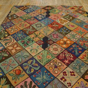Highly colorful, textured rug featuring unique floral motifs within a diamond grid on rustic wood flooring.